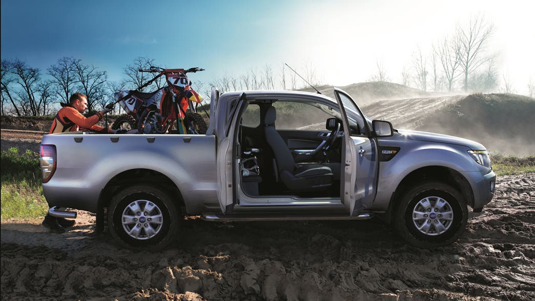 Man loading a Motocross bike into a Ford Ranger