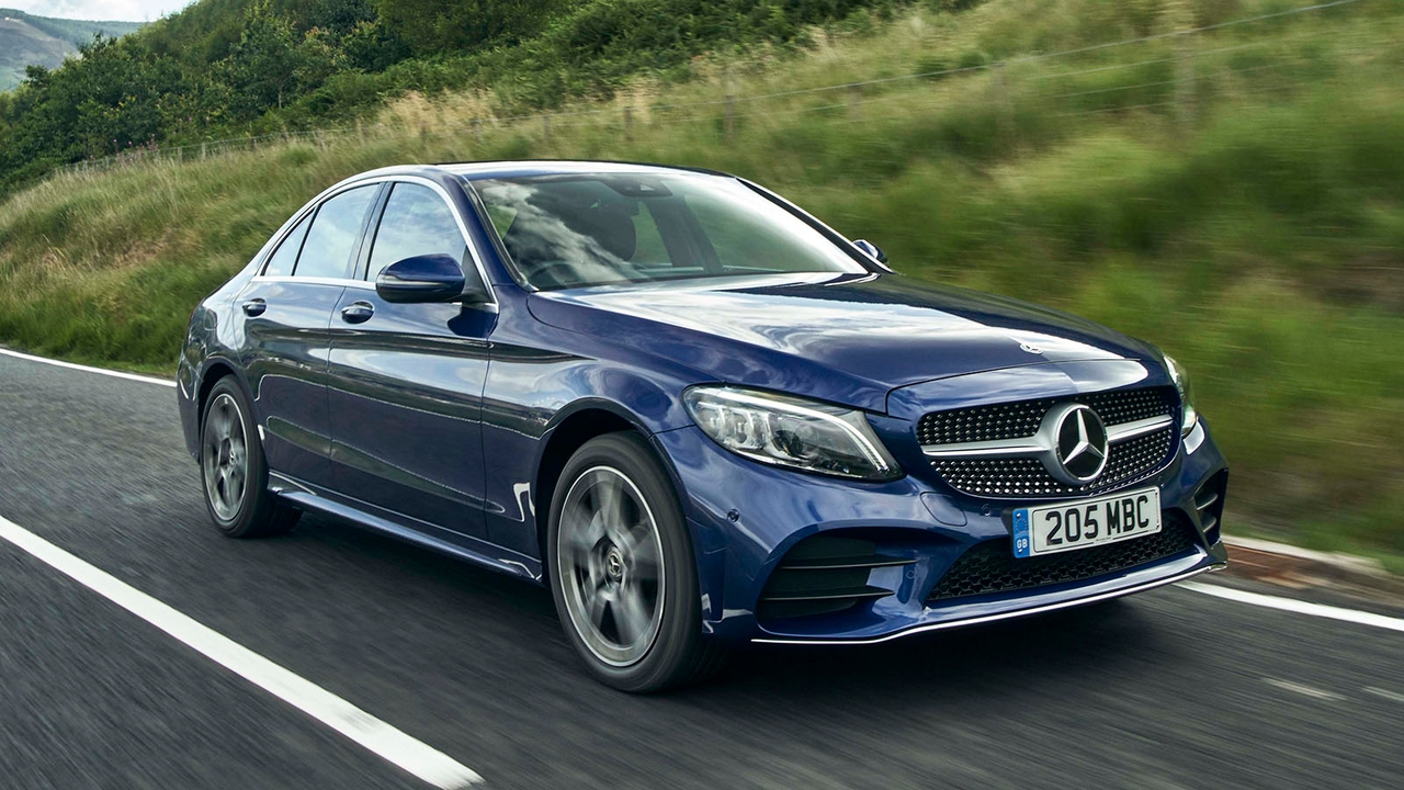 Mercedes C-Class in blue, driving shot