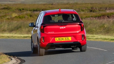 Kia Picanto driving rear view, red