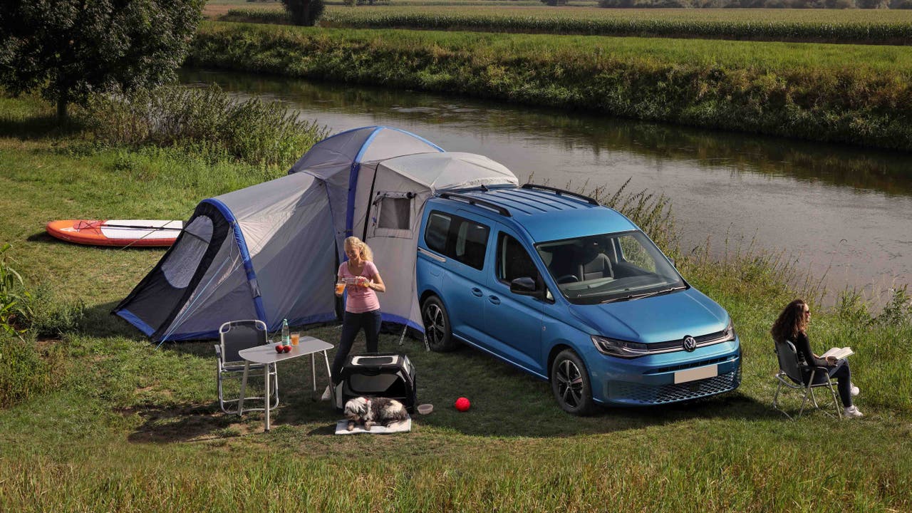 People camping in a VW Caddy California
