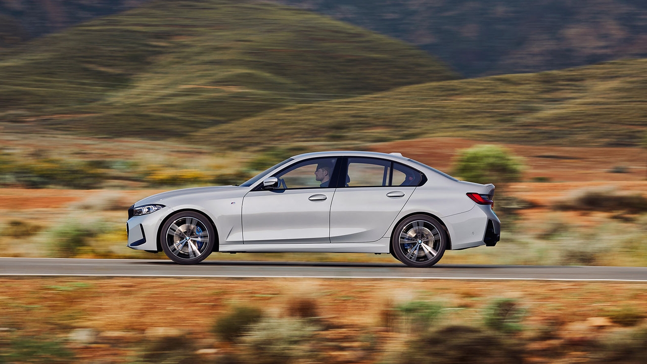 BMW 3 Series in grey, driving shot