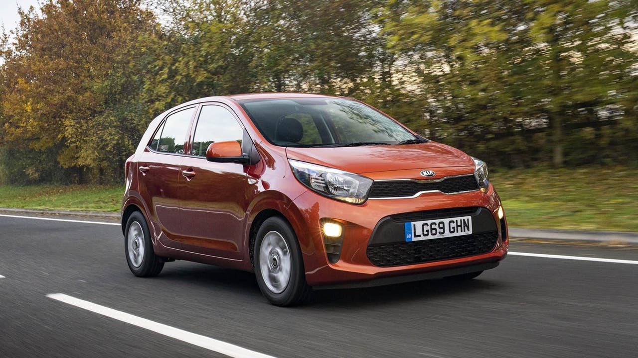 Kia Picanto in orange, driving shot