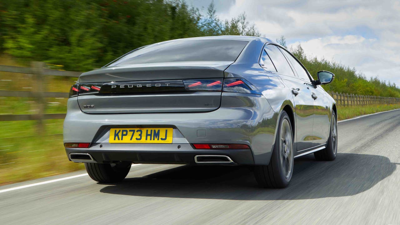 Facelifted Peugeot 508 driving - rear view