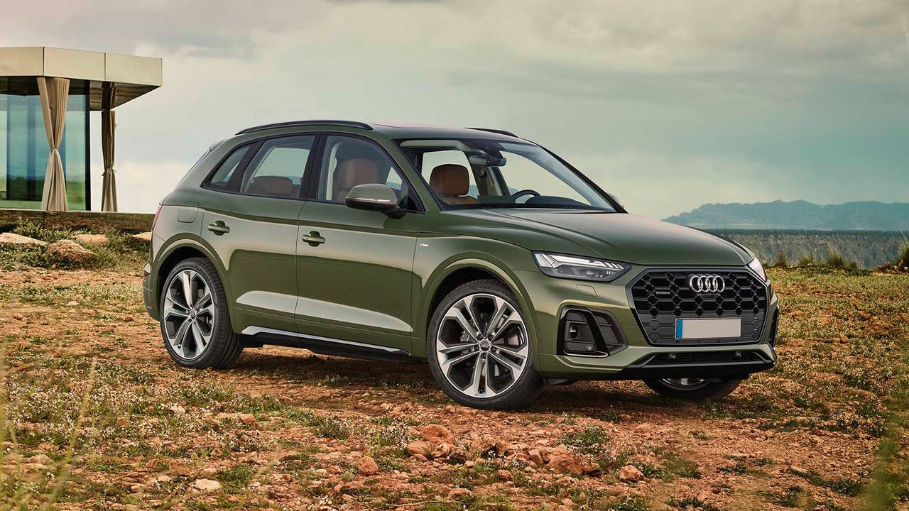 Audi Q5 in green parked in a field