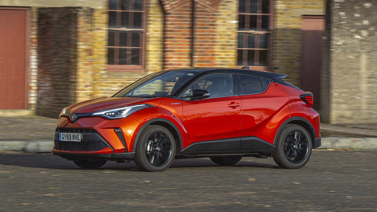 Toyota C-HR in orange, driving shot