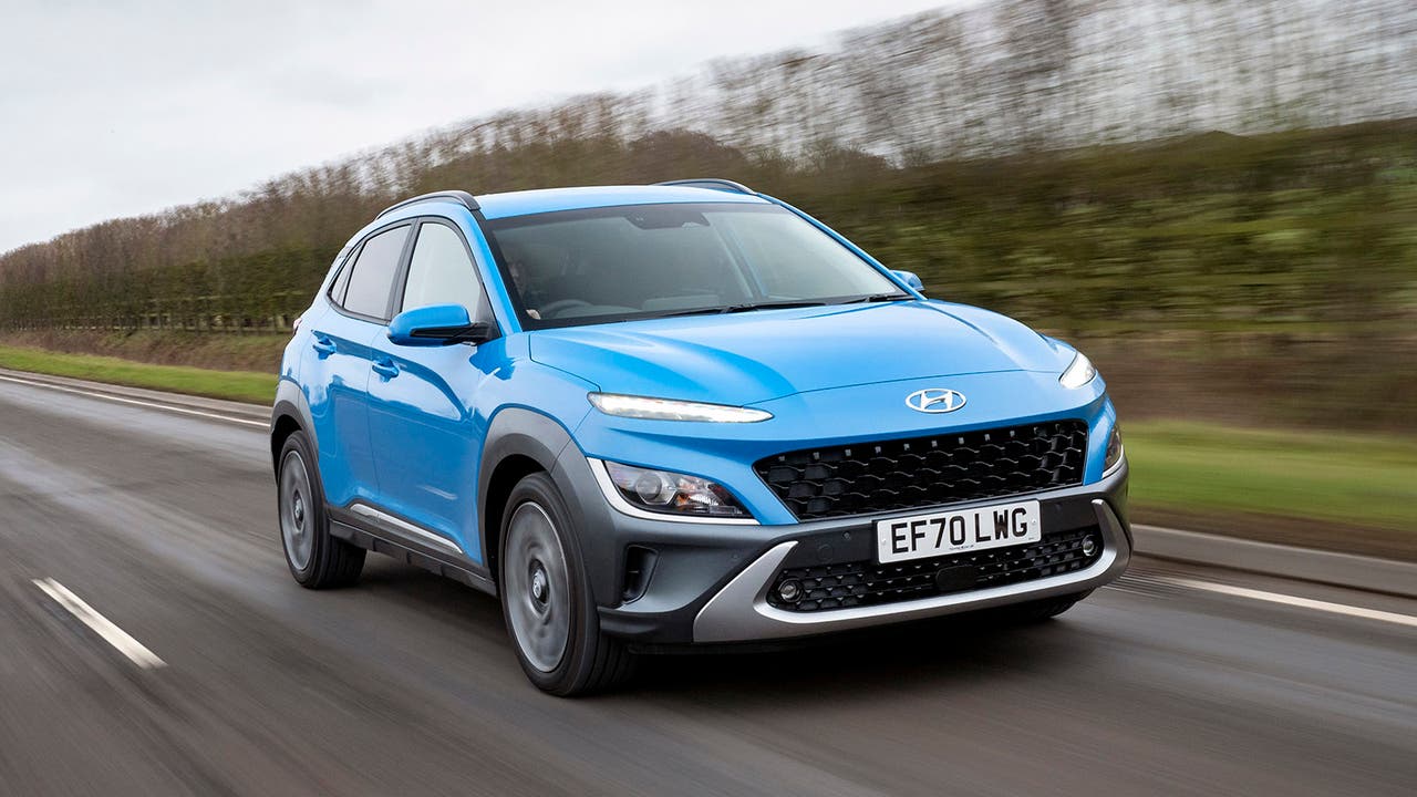 Hyundai Kona in blue, driving shot