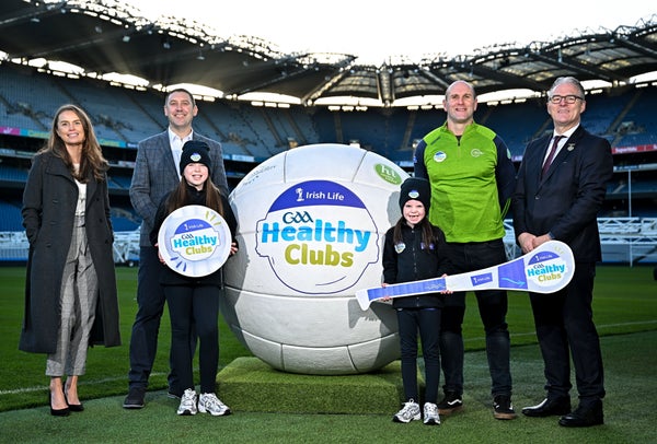 Group at Croke Park with a large Irish Life GAA Healthy Clubs football and promotional signs