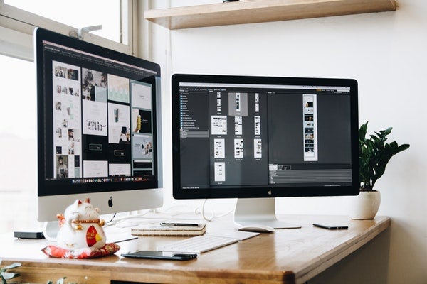 Two desktops on a table