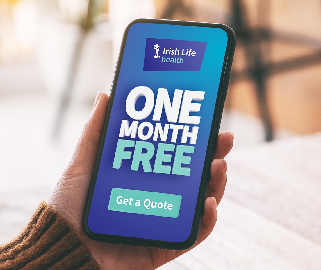 Hand holding a smartphone displaying text that says one month free