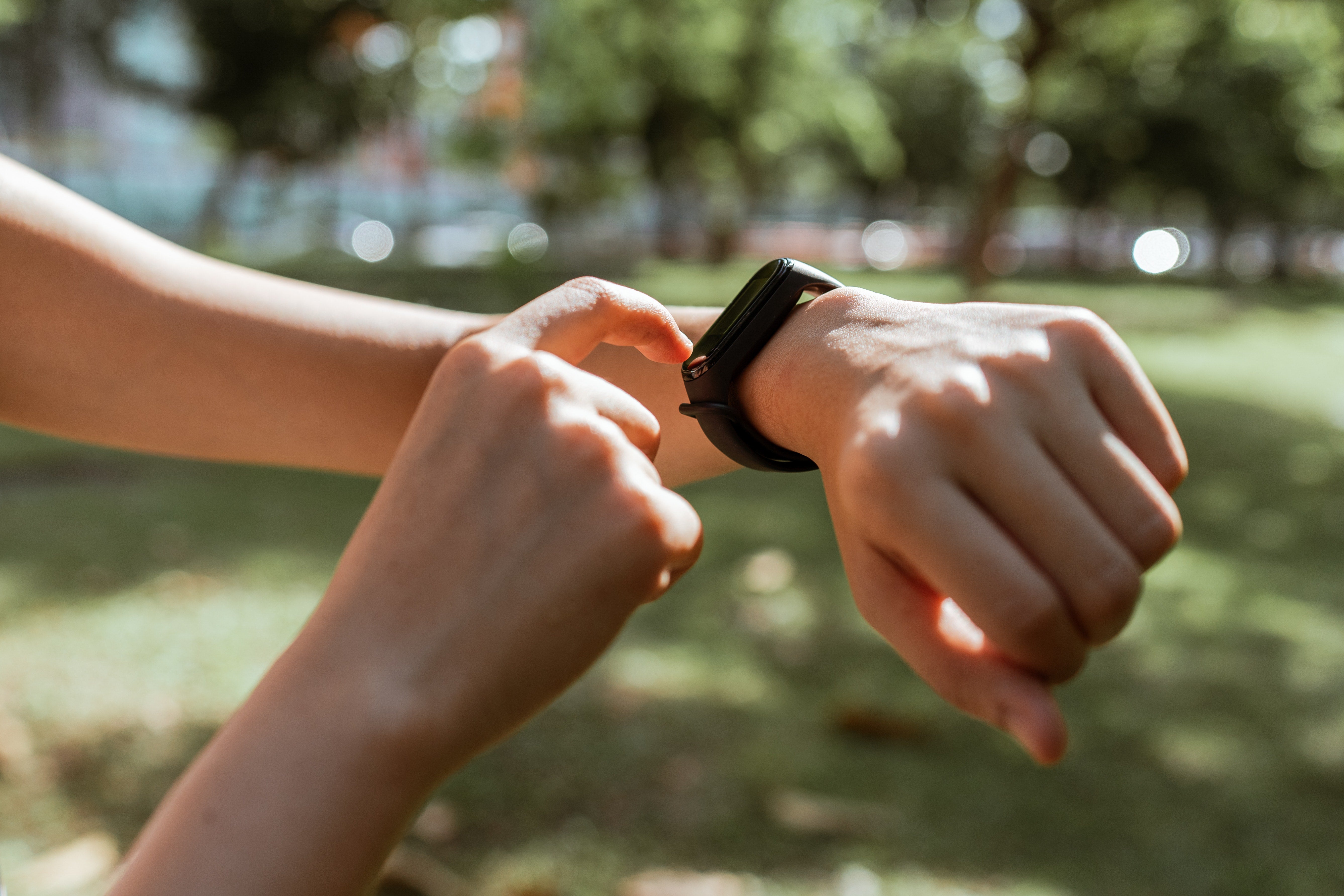 Hand with fitbit on wrist