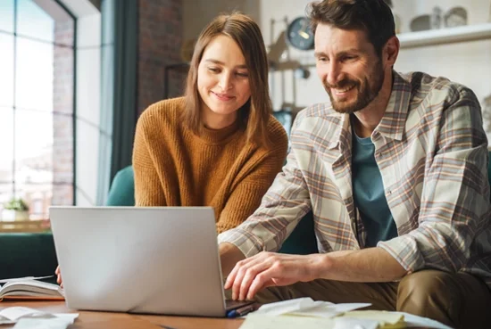 young couple on a laptop