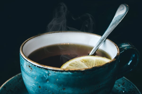Blue tea cup with lemon tea